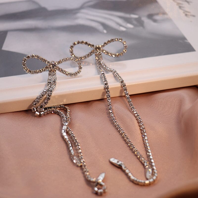 RHINESTONE BOW LONG CHAIN EARRINGS IN WHITE Earrings styleofcb