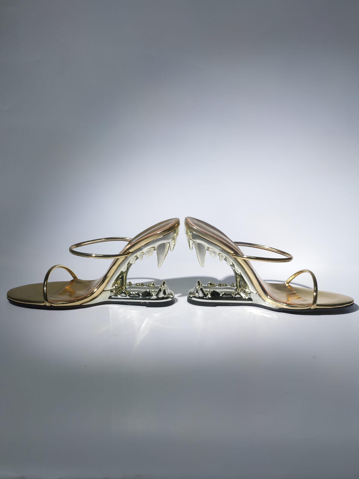 TIGER TOOTH CUTOUT HEELS IN GOLD